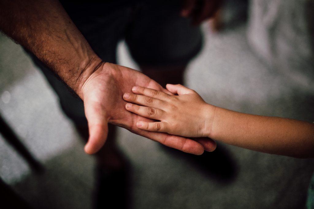 Father and son holding hands